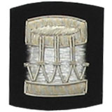 Embroidered Silver wire on black cloth drum insignia badge
