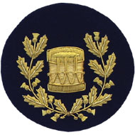 Hand Embroidered gold wire on navy blue cloth wreathed drum Drum Major insignia badge
