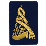 Hand Embroidered gold wire on navy blue cloth bagpipes insignia badge