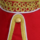 Red Piper Doublet with Gold Scrolling Trim collar detail